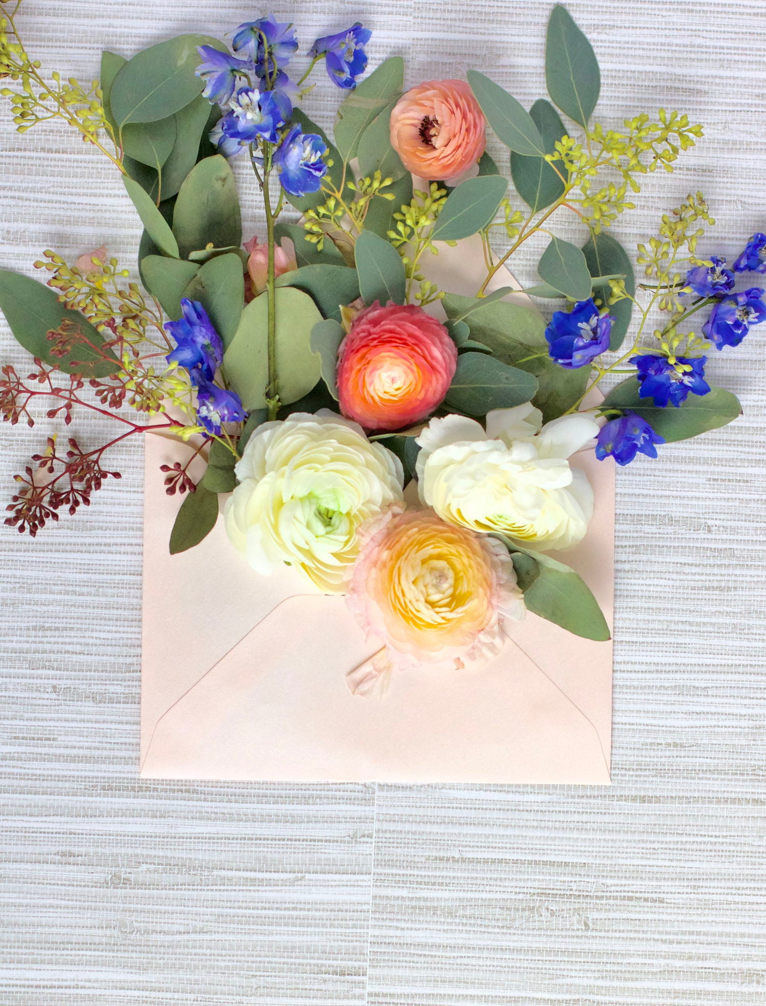 Floral arrangement with glowing lights on a textured surface